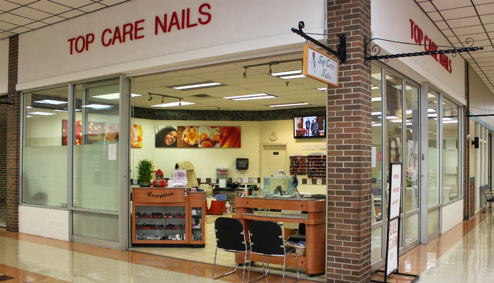 The Top Care Nails storefront and reception desk inside the Union Street plaza